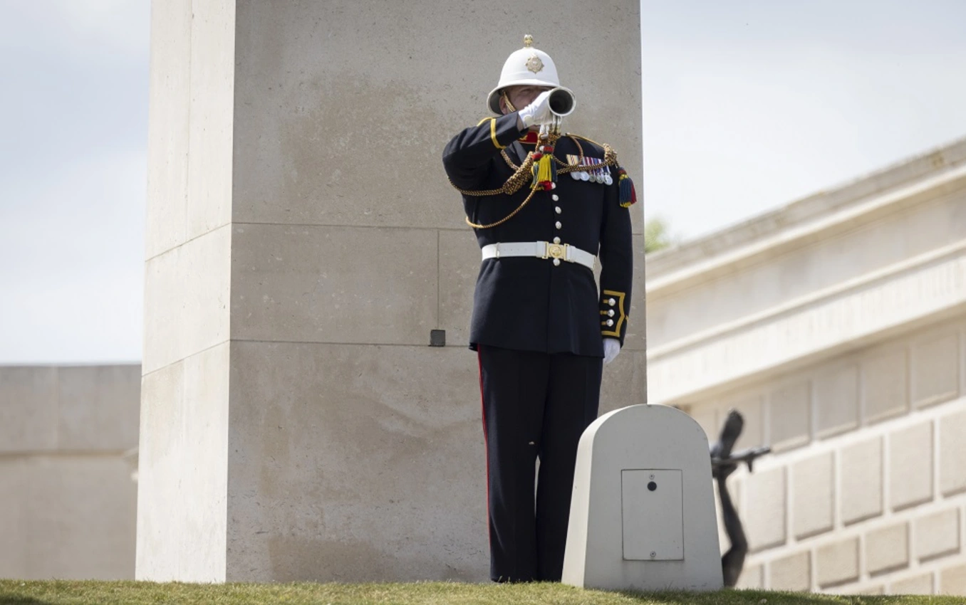 Bugler playing The Last Post in front of the Armed Forces Memorial