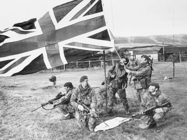 Marines of 40 Royal Marine Commando raise the British flag on West Falkland after the Argentine surrender