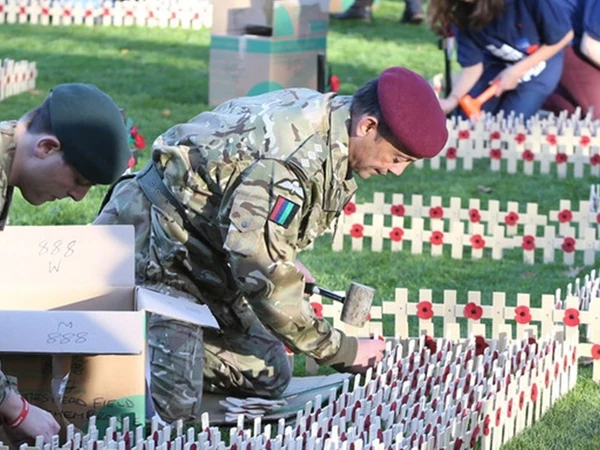 Volunteers from the Armed Forces creating Field of Remembrance