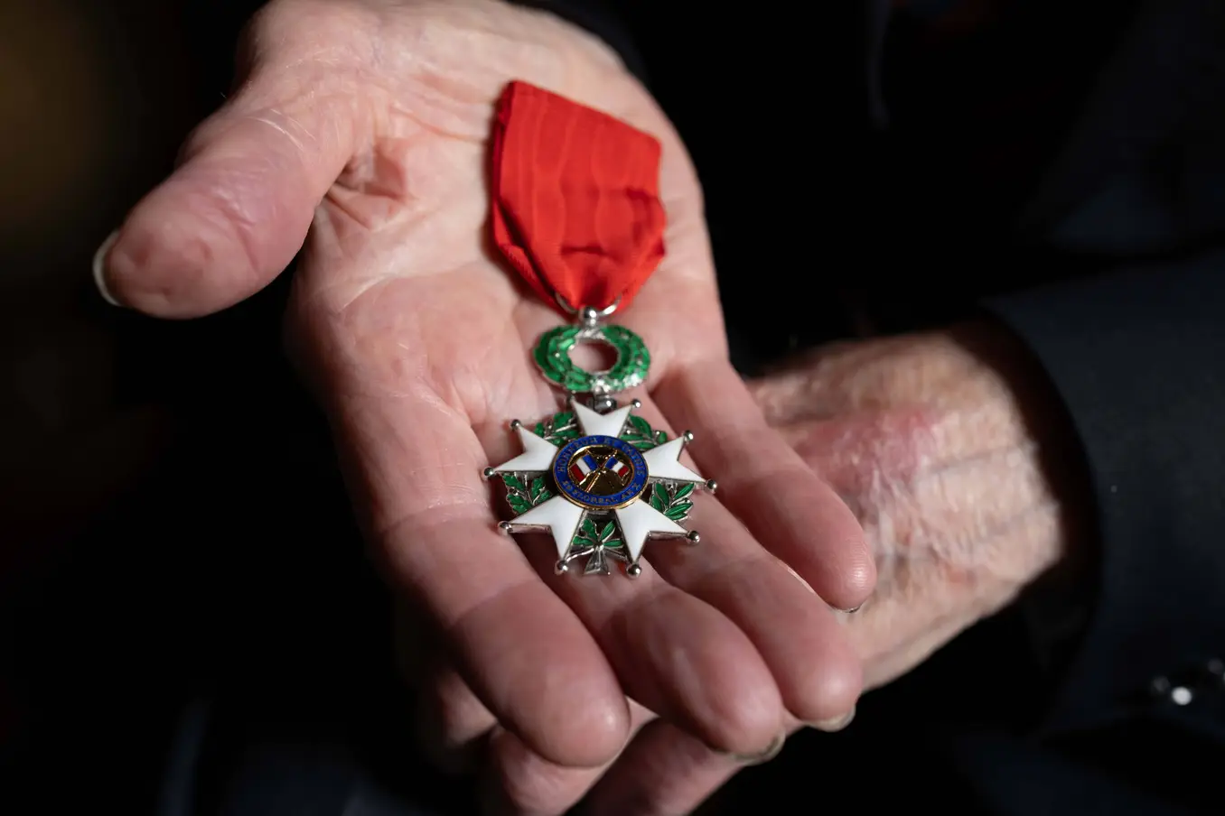 John Gillespie holding medals