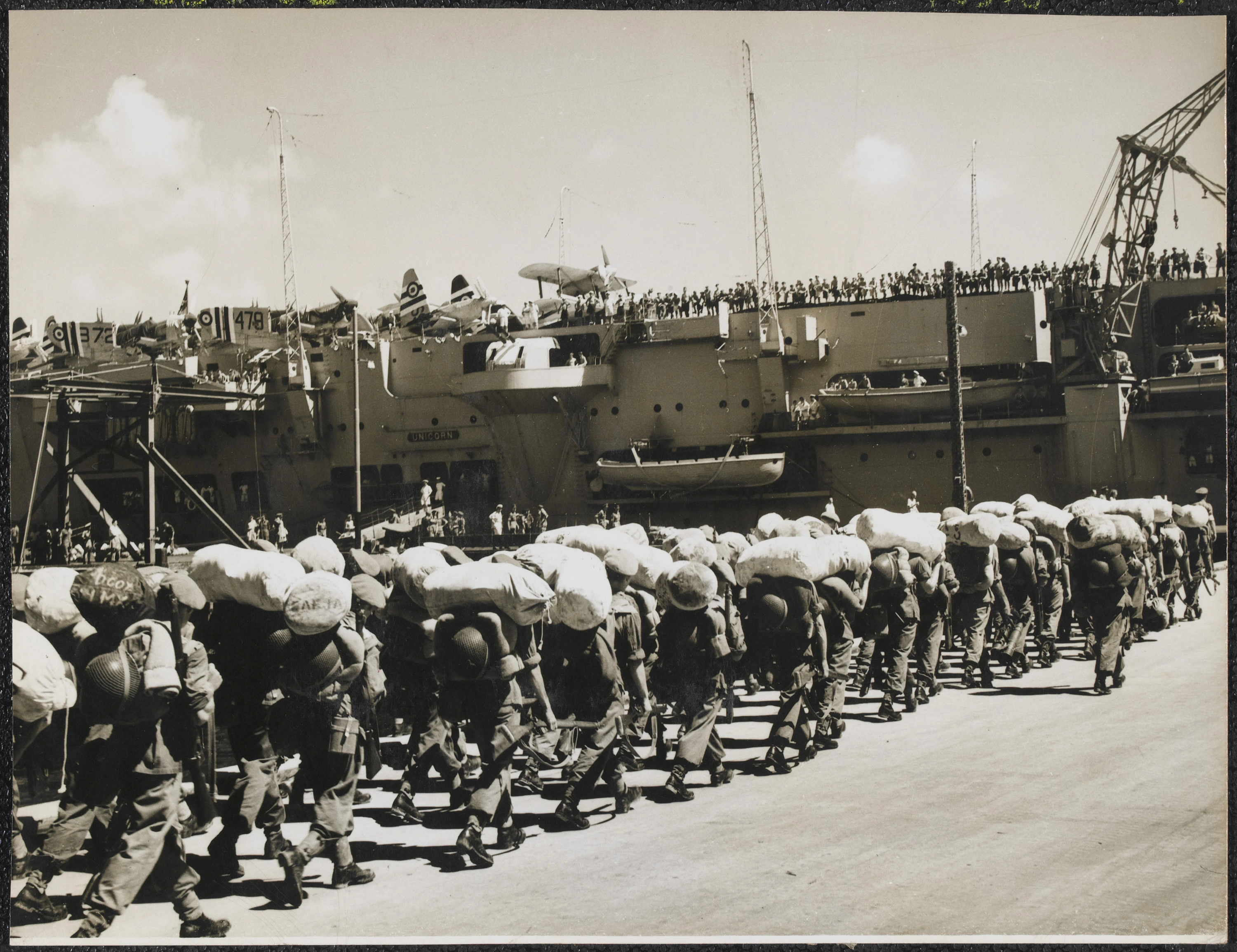 British troops board HMS 'Unicorn' at Hong Kong for the voyage to Korea - Image courtesy of the National Army Museum, London