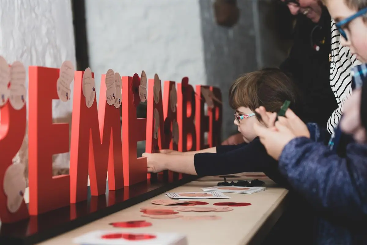 Children interacting with a Remembrance installation