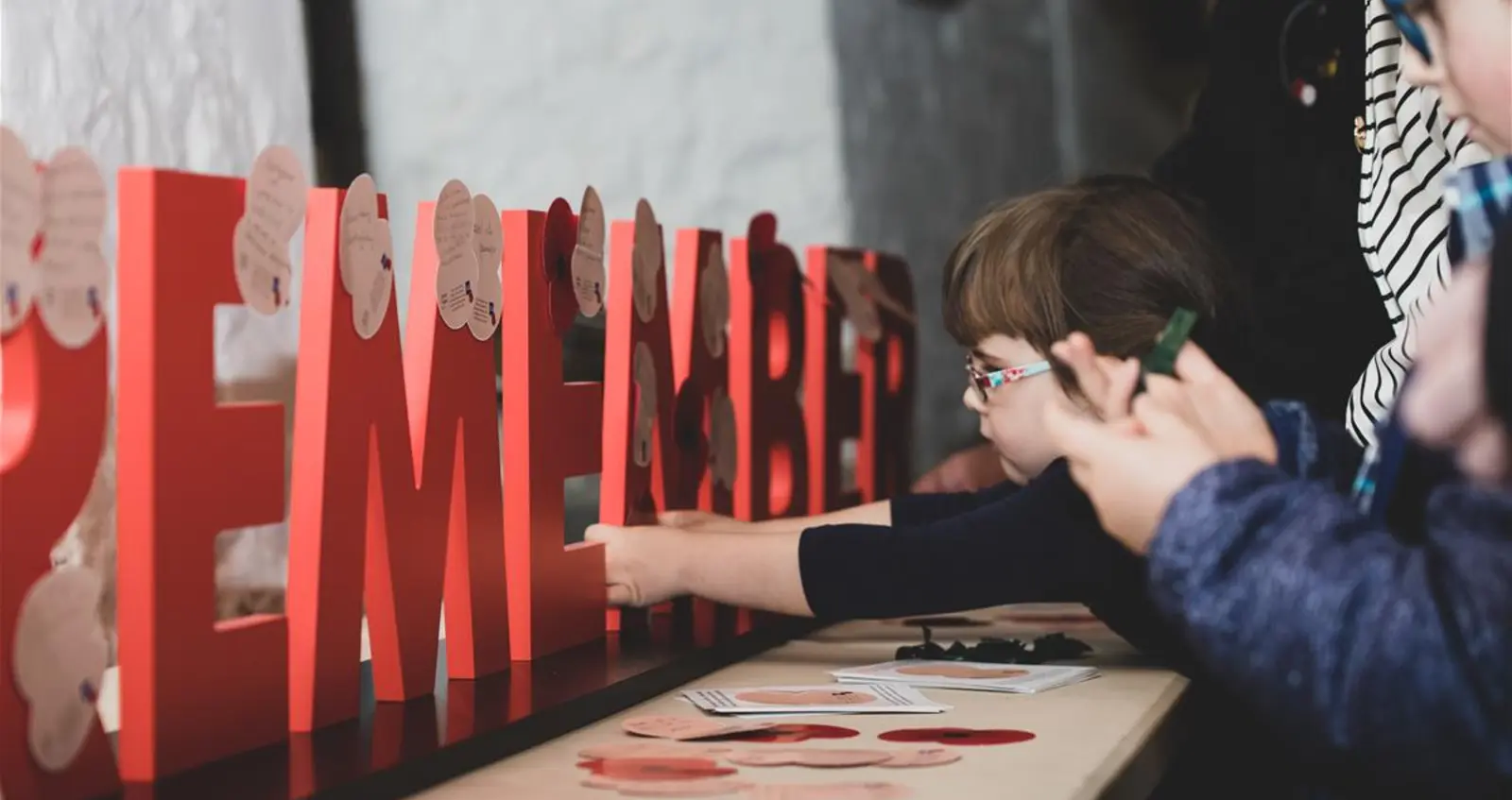 Children interacting with a Remembrance installation