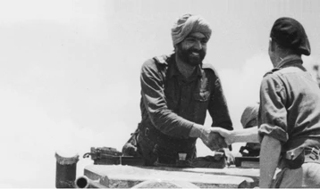 Meeting at MS 109 of the 7th Cavalry and 33 Corps. Jemader Karnail Singh of 7th Cavalry shakes hands with Major AC T Brotherton, a 33 Corps Staff Officer (Credit: @IWM HU 88980)
