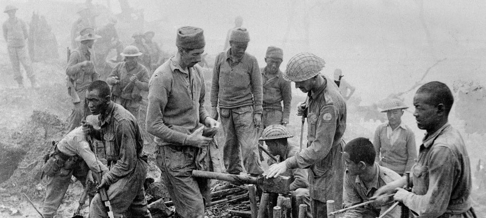Indian and Gurkha soldiers inspect captured Japanese ordnance during the Imphal-Kohima battle, 1944