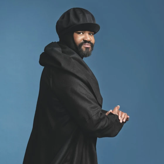 Gregory Porter Man dressed in black wearing hat