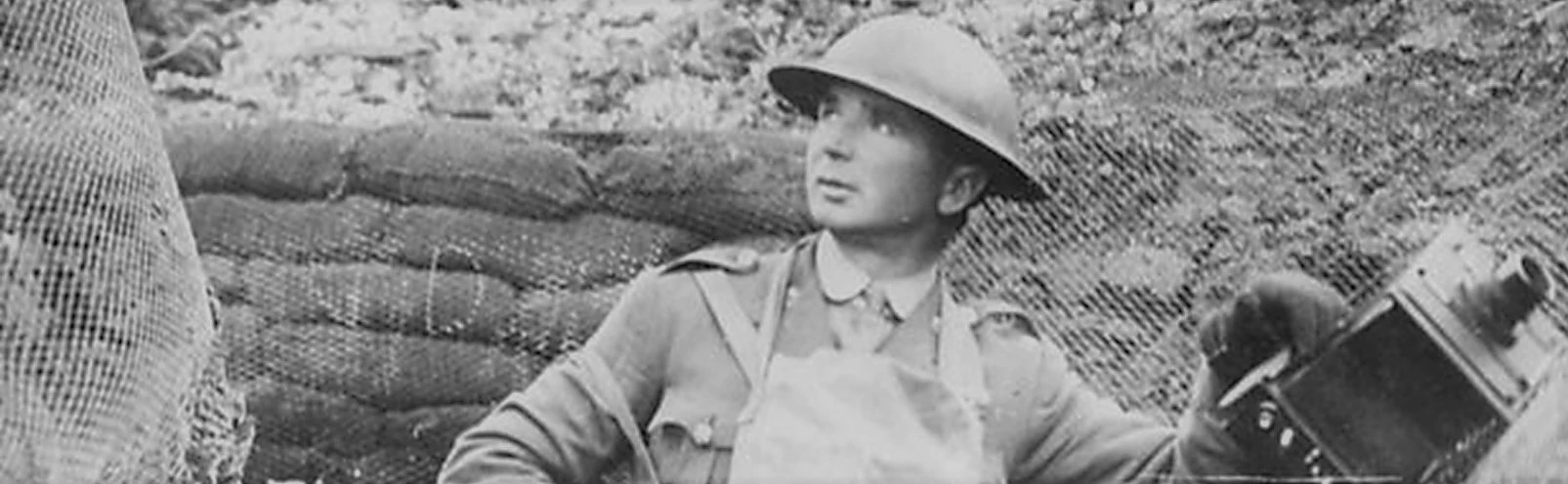 Ernest Brooks with camera in trench