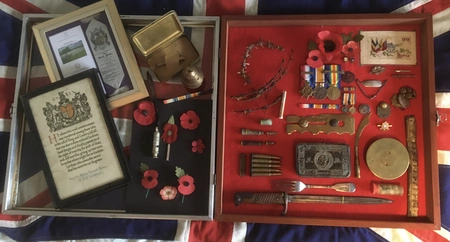 Display case of WW1 items taken into School in November. ""