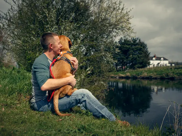 Paul Glazebrook with dog on river bank Paul Glazebrook with dog on river bank