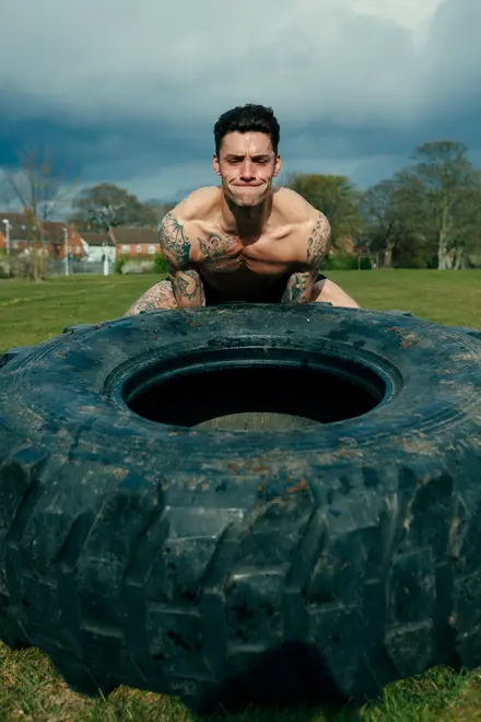 Sam Bailey lifting tyre