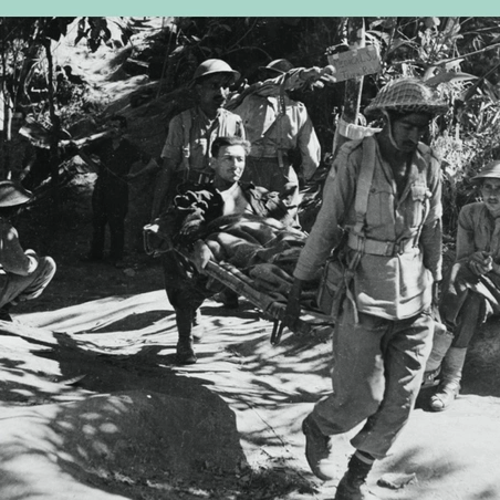 A wounded British soldier being evacuated by Indian Army stretcher bearers, Burma