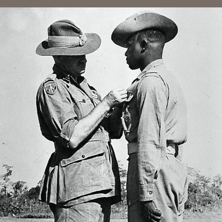 Lieutenant-General Sir William Slim awarding the Military Medal to Sergeant Jilalo Gafo, 11th East African Division