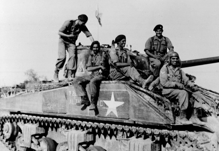 Indian tank crew astride their Sherman tank