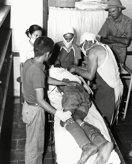shutterstock_editorial_7412572a Injured soldier in field hospital