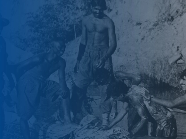 West African and Indian troops bathing in a stream