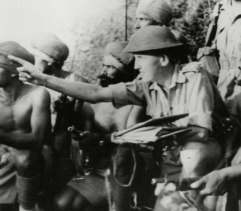 An Indian patrol receiving instructions from their British officer