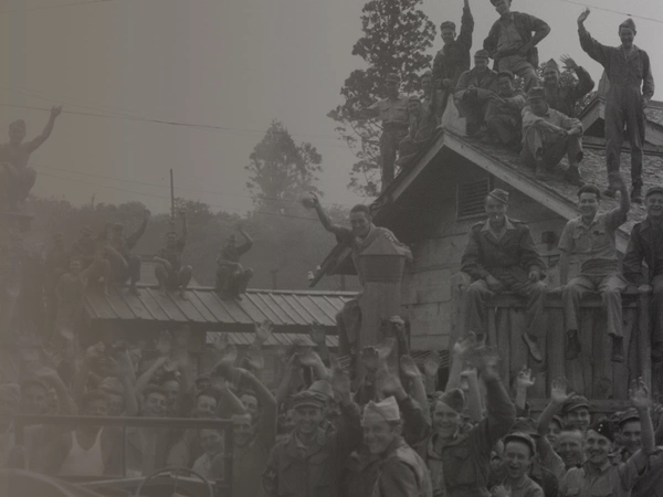 Allied POWs including British & American from Hanawa Camp, Honshu cheer their liberation, 14th September 1945