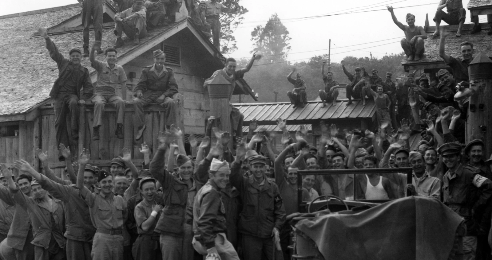 Allied POWs including British & American from Hanawa Camp, Honshu cheer their liberation, 14th September 1945