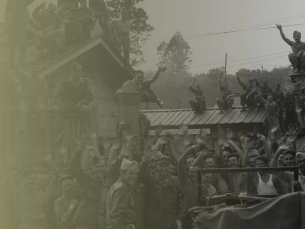 VJ DAY-THEMEHERO-5-ASSET-002 Allied POWs including British & American from Hanawa Camp, Honshu cheer their liberation, 14th September 1945
