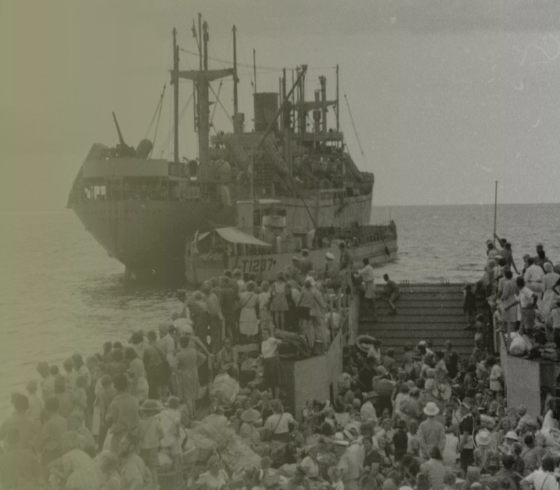 Repatriated prisoners of war evacuated to safer areas - scene shows the landing craft approaching the merchant ship