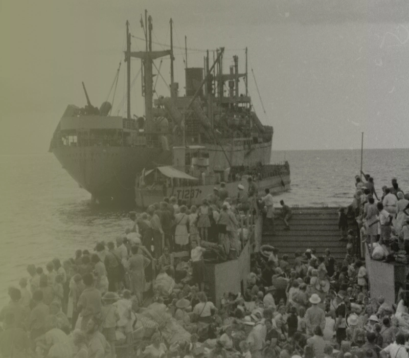 VJ DAY-THEMEHERO-5-ASSET-008 Repatriated prisoners of war evacuated to safer areas - scene shows the landing craft approaching the merchant ship