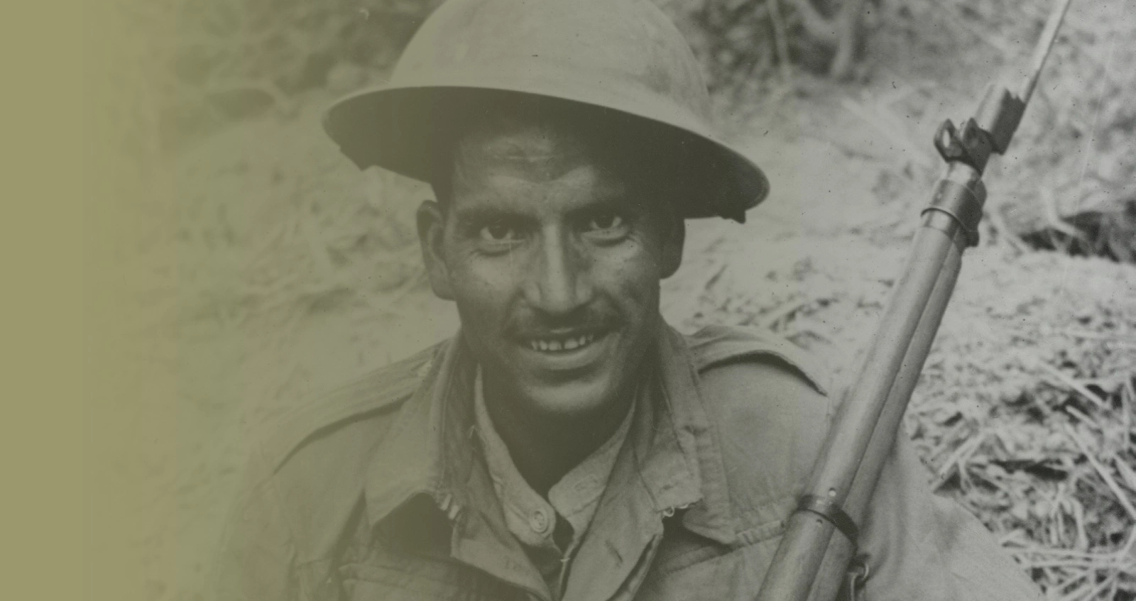 A sharp shooter of the Indian Army, fighting in alliance with the British, poses with his rifle, at an unknown location in Burma, in March 1944