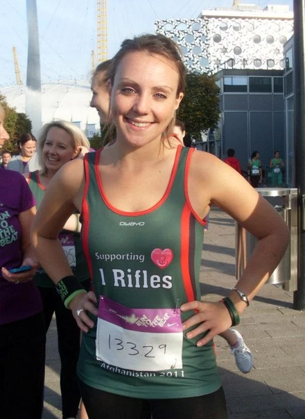 Victoria standing in a running jersey before a running event