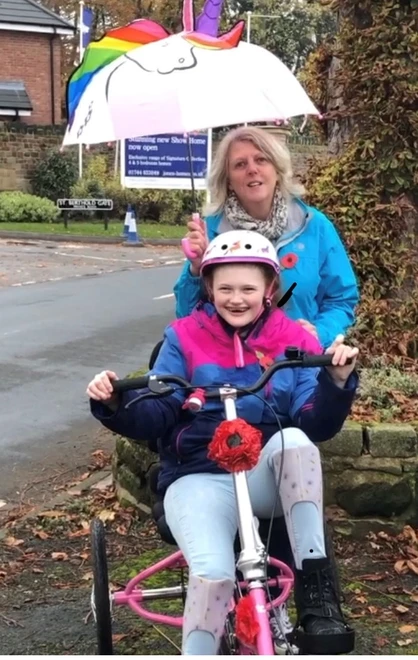 Melissa and her mum Kathryn on her Poppy trike ride