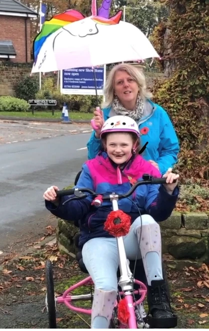 Melissa and her mum Kathryn on her Poppy trike ride Melissa and her mum Kathryn on her Poppy trike ride