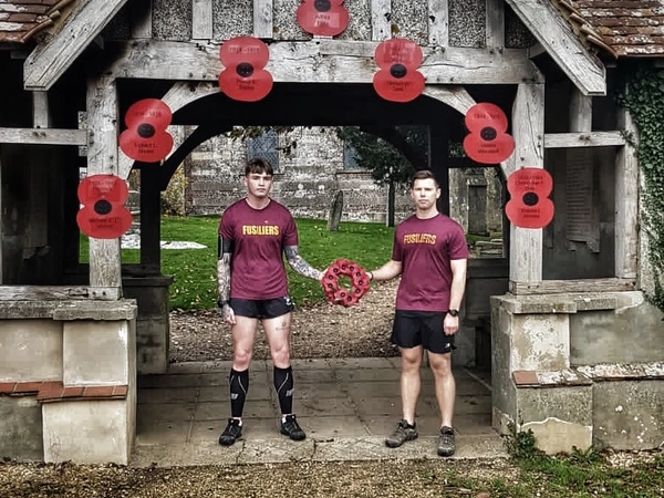 two fusiliers at a poppy wreath handover two fusiliers at a poppy wreath handover