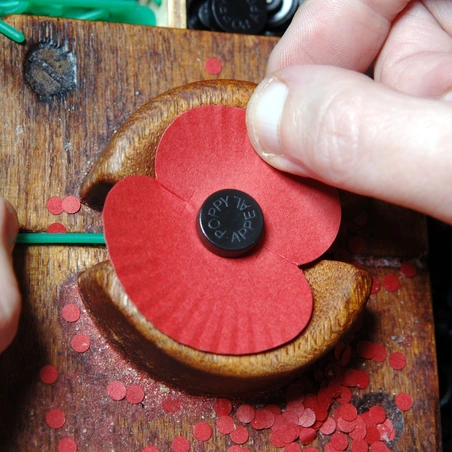 A paper poppy being made