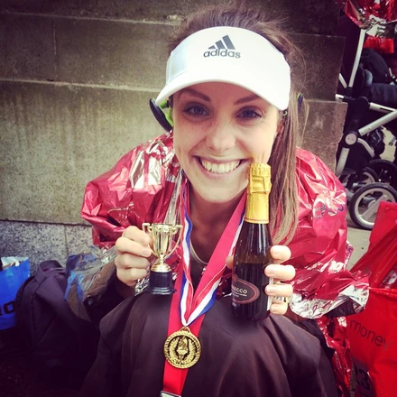 Victoria with her medal after a running event 