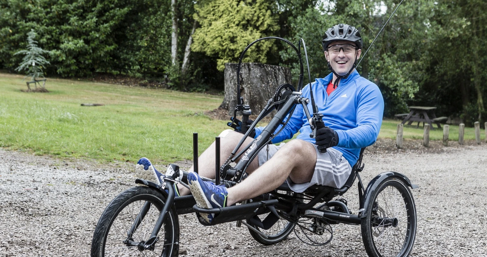 Wheelchair adaptive bike at Battle Back Centre Man on wheelchair adaptive bike at Battle Back Centre