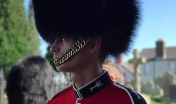 British Army soldier Adam, wearing a bearskin