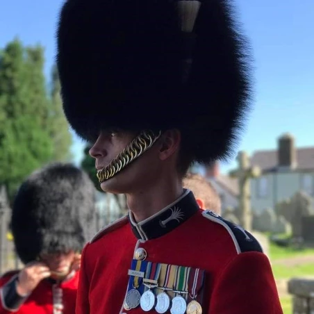 British Army soldier Adam, wearing a bearskin