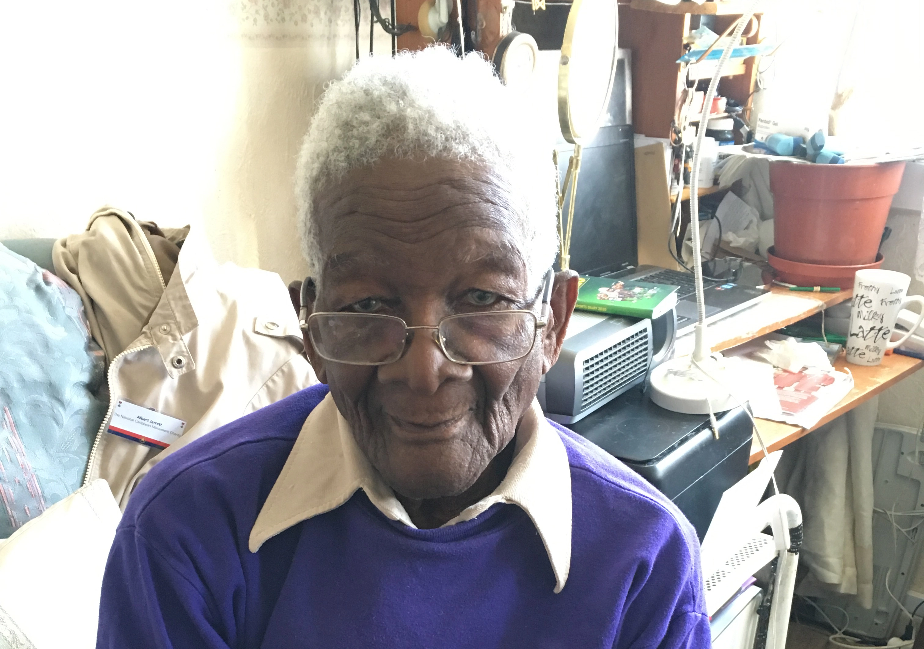 Albert Jarret sat in his home.