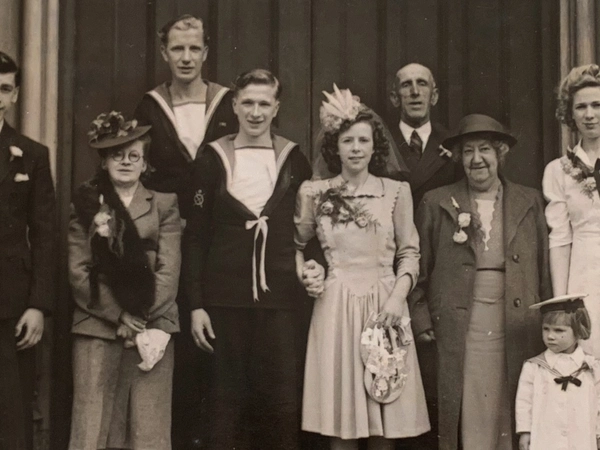 Alec Penstone and Gladys on their wedding with guests.