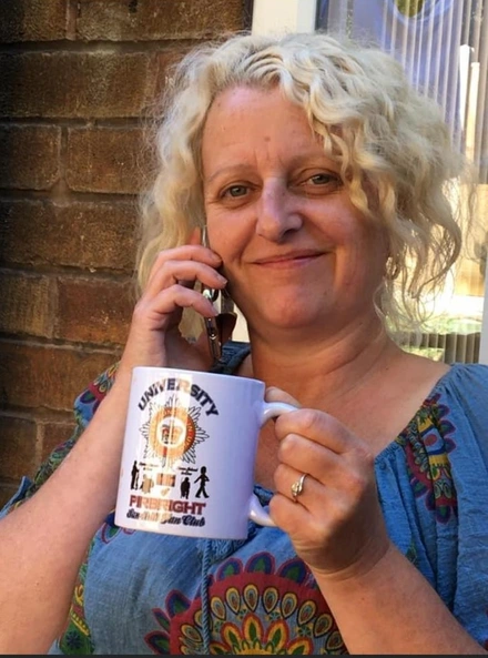 Ann holding mug Ann holding mug
