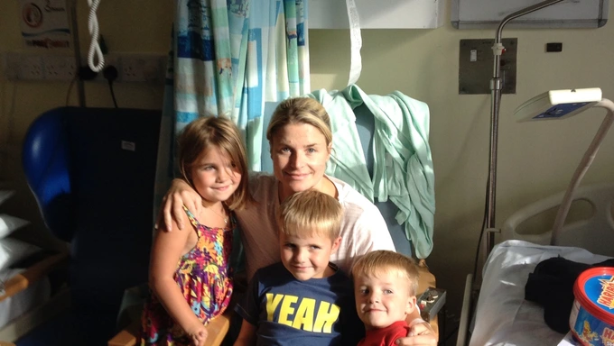 Anna Pollock in hospital with her children Anna in hospital with her children