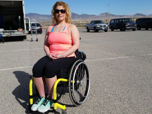 Anna Pollock in wheelchair outdoors