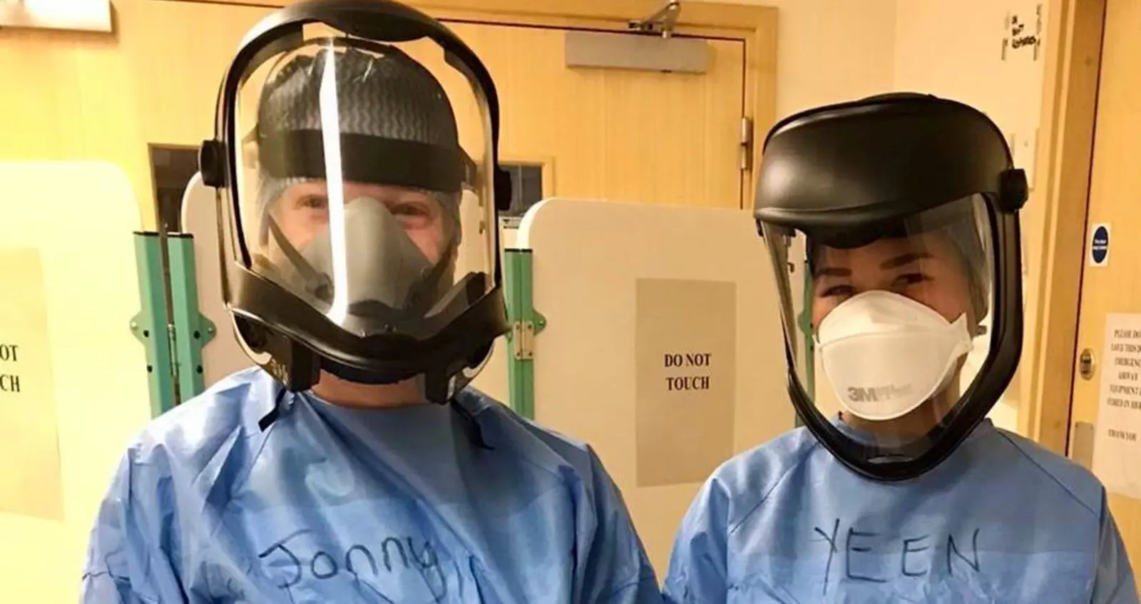 Apassara at work with a colleague in PPE