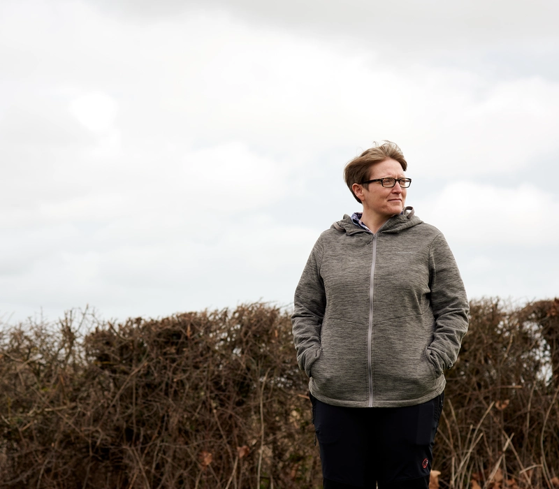 Becky Eckersley looking on in a field