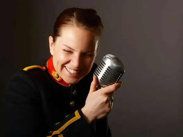 Poppy Pawsey in her band uniform singing