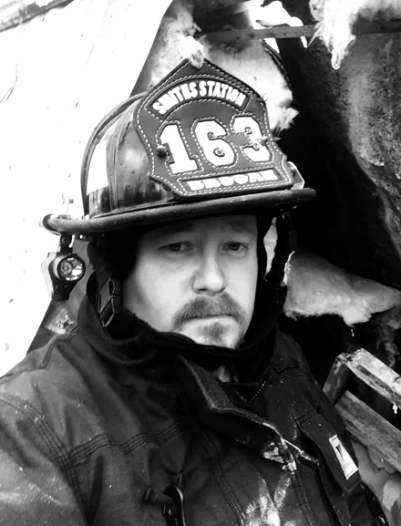 Chris volunteering as a firefighter Chris volunteering as a firefighter