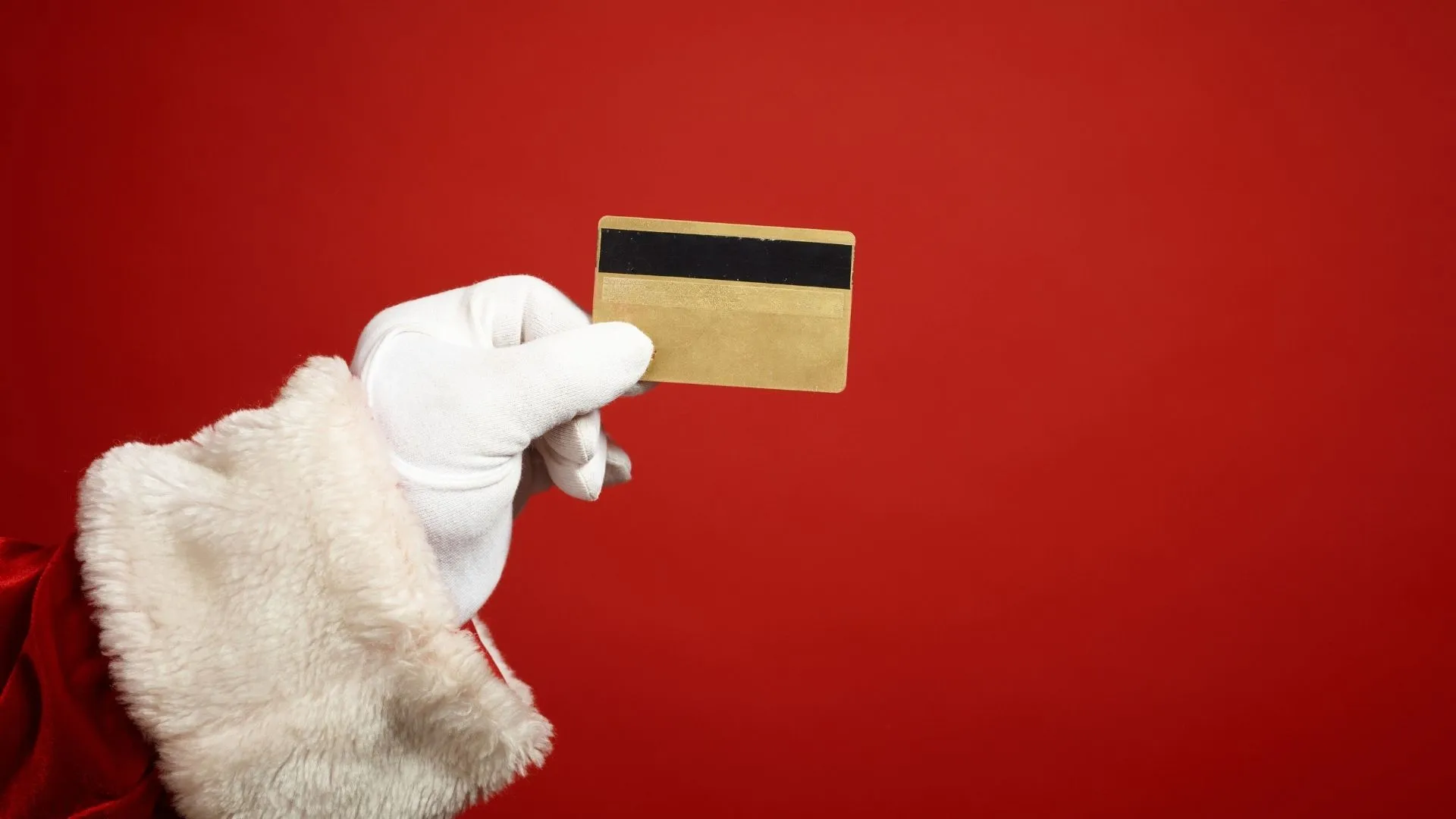 Santa holding a credit card