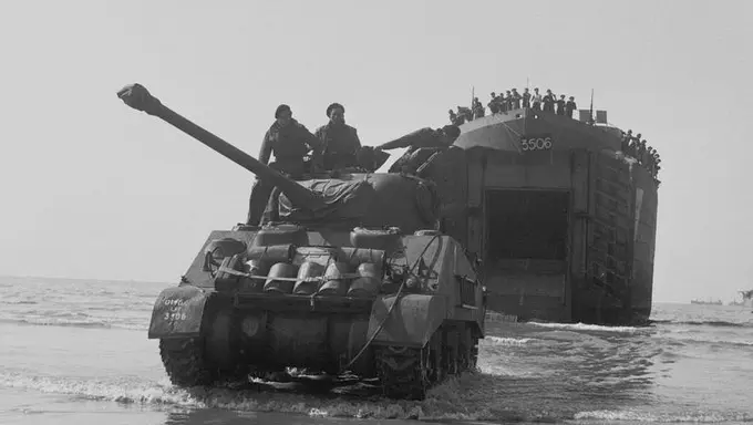 B 5130 A Sherman Firefly tank comes ashore, 7 June 1944.