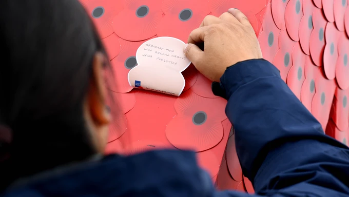 Women reading a message on D-Day installation