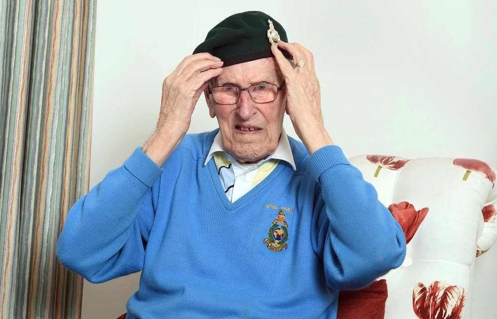 Denis Fawcett adjusts his beret