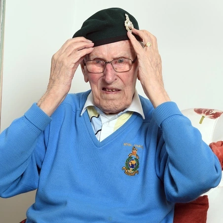 stories_denis_fawcett_hat Denis Fawcett adjusts his beret