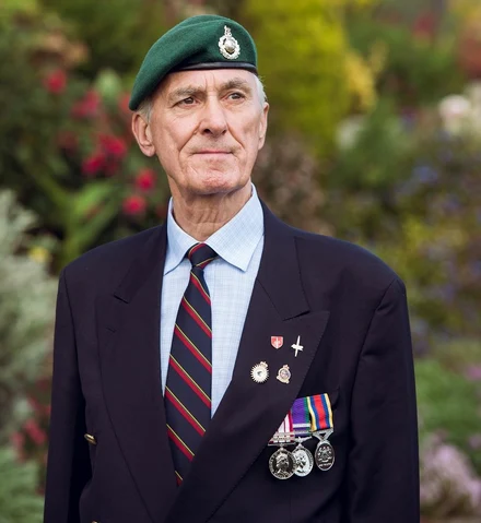 Denis Sparrow wearing badges and medals for Remembrance